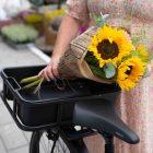 A bouqe with sunflowers in a crate