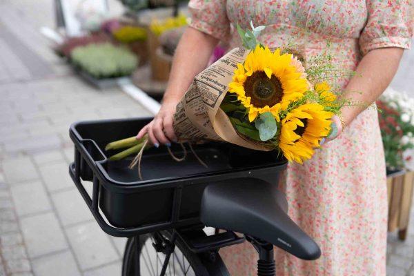 A bouqe with sunflowers in a crate