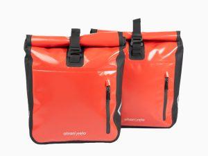 Two red travel bags from the front