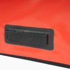 Red travel bag zoomed in