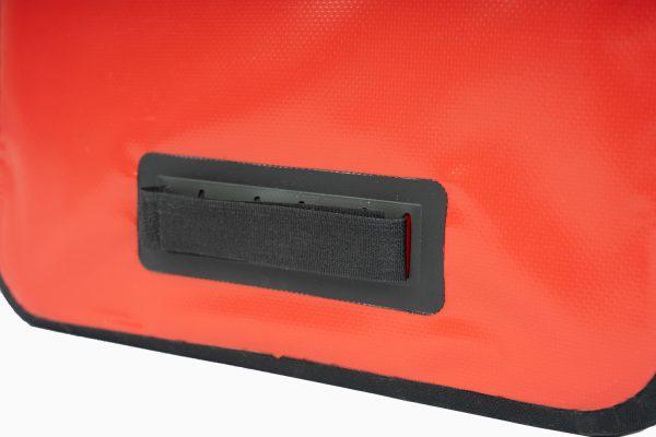 Red travel bag zoomed in