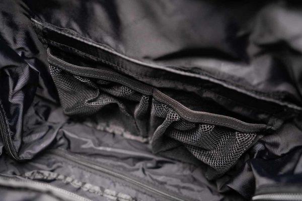 Inside of a travel black, it is a black interior mesh and you can see two pockets