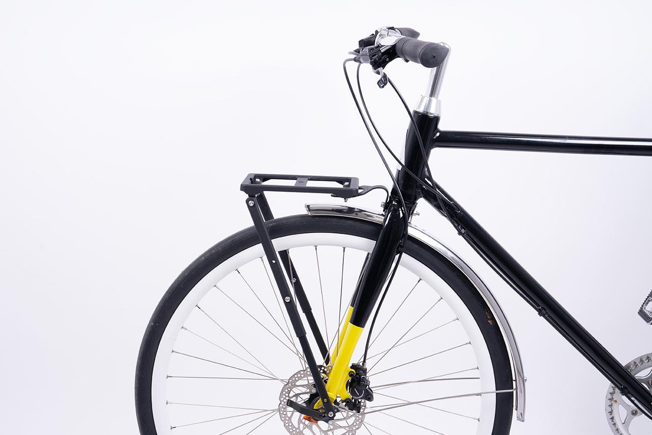 A black carrier studiophoto on a bike