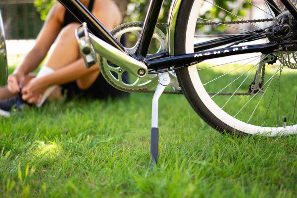 A close-up of a chrome-colored bike stand.