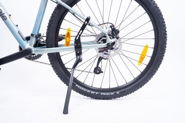 Black kickstand on a bike in a studio with white background