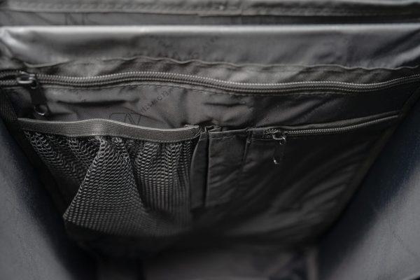 Inside of a max side pannier, it is a black interior mesh and you can see two pockets