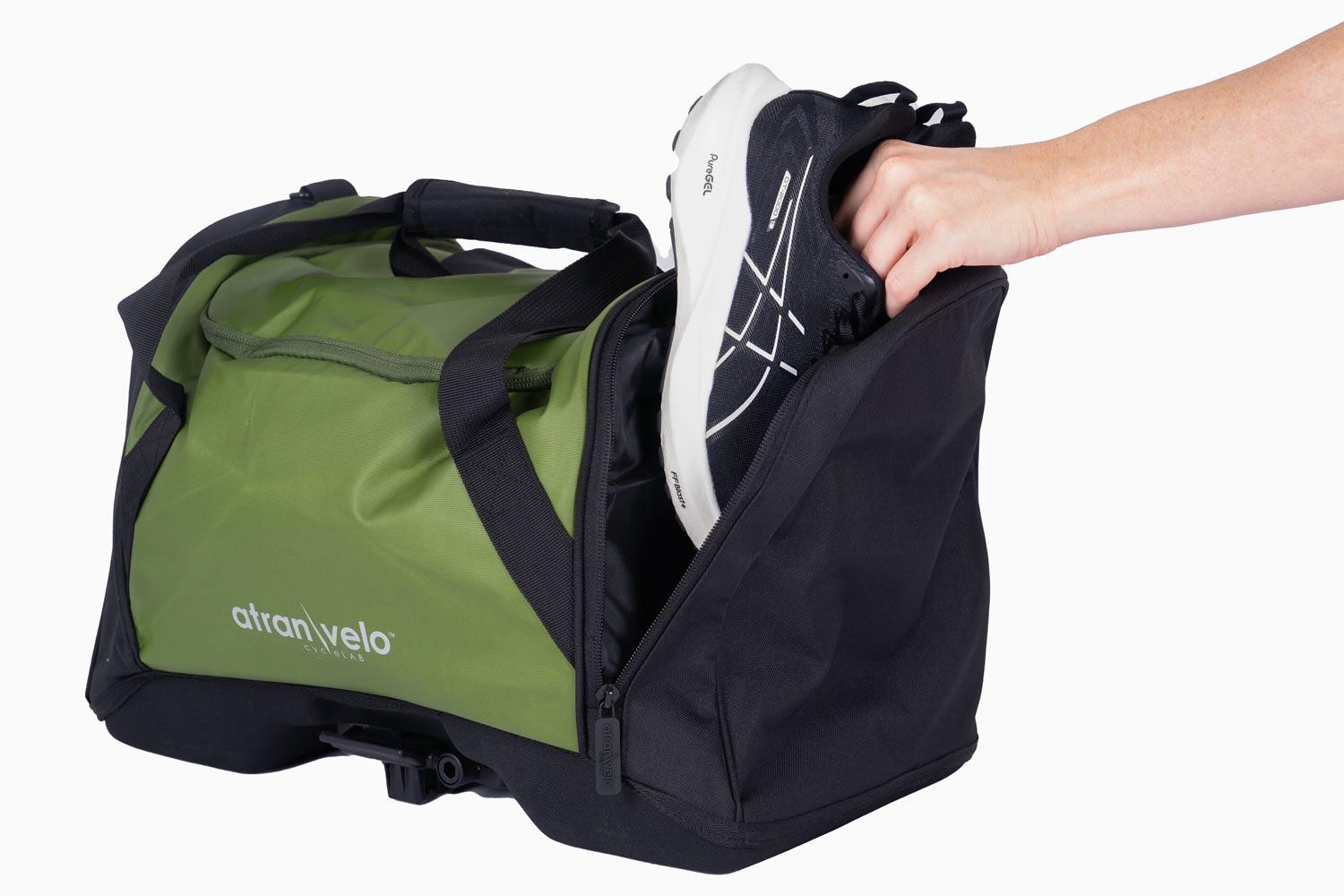 A Bag in a studio and a girl putting down gym shoes in one of the side pockets