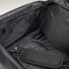 Inside of a pulse duffle bag, you cam see a black inside mesh and one zippered pocket