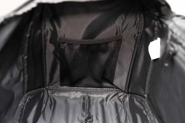 Inside of a pulse duffle bag, you cam see a black inside mesh and one pocket