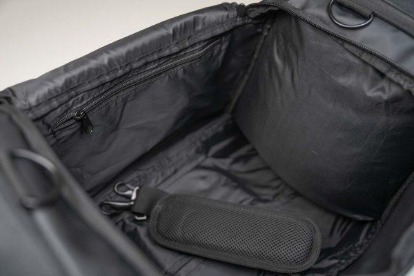 Inside of a pulse duffle bag, you cam see a black inside mesh and one zippered pocket