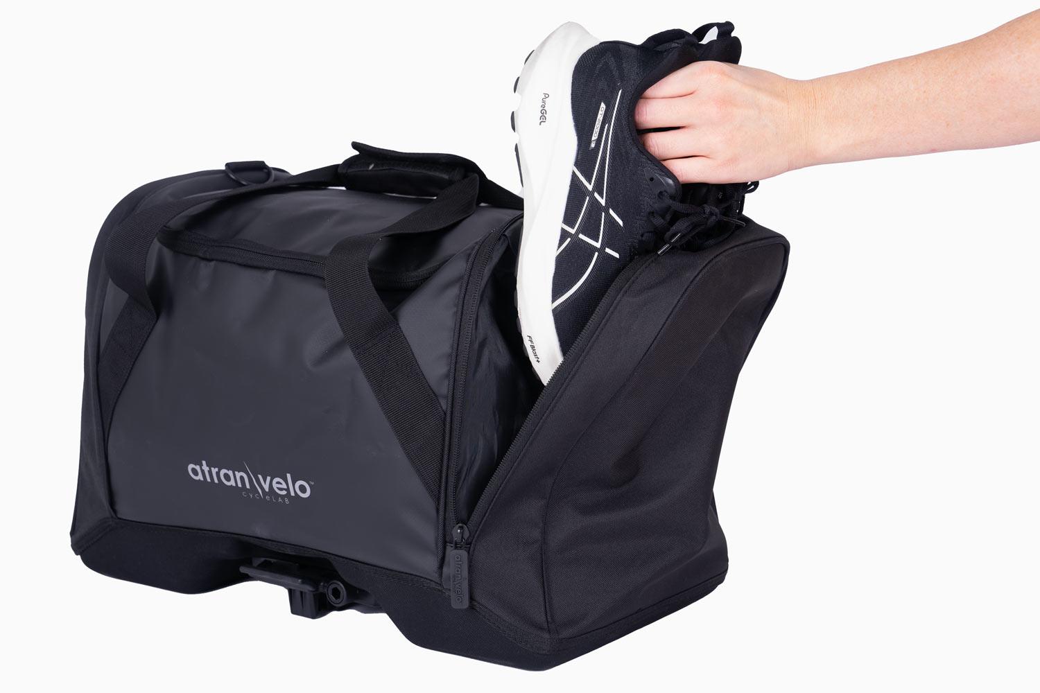 A Bag in a studio and a girl putting down gym shoes in one of the side pockets