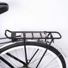 A back carrier with a spring clamp on a bicyclle