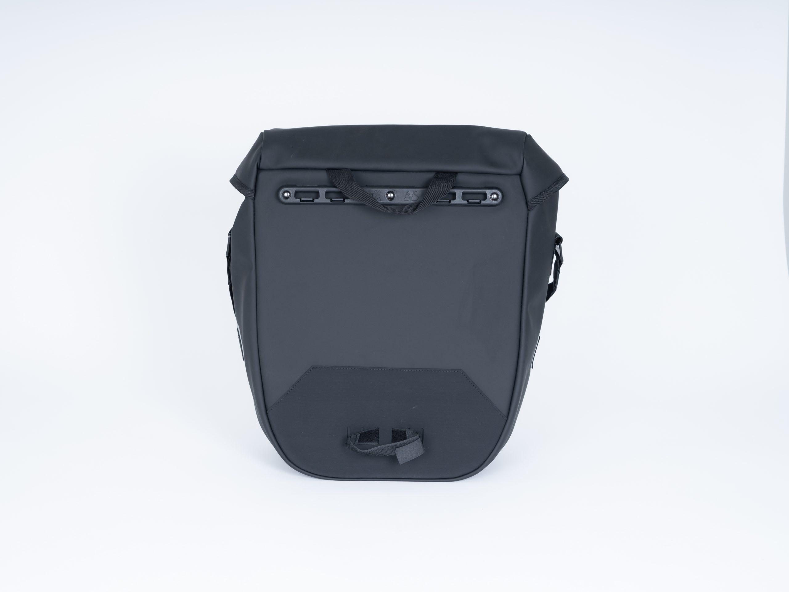 A black sidebag in a studio