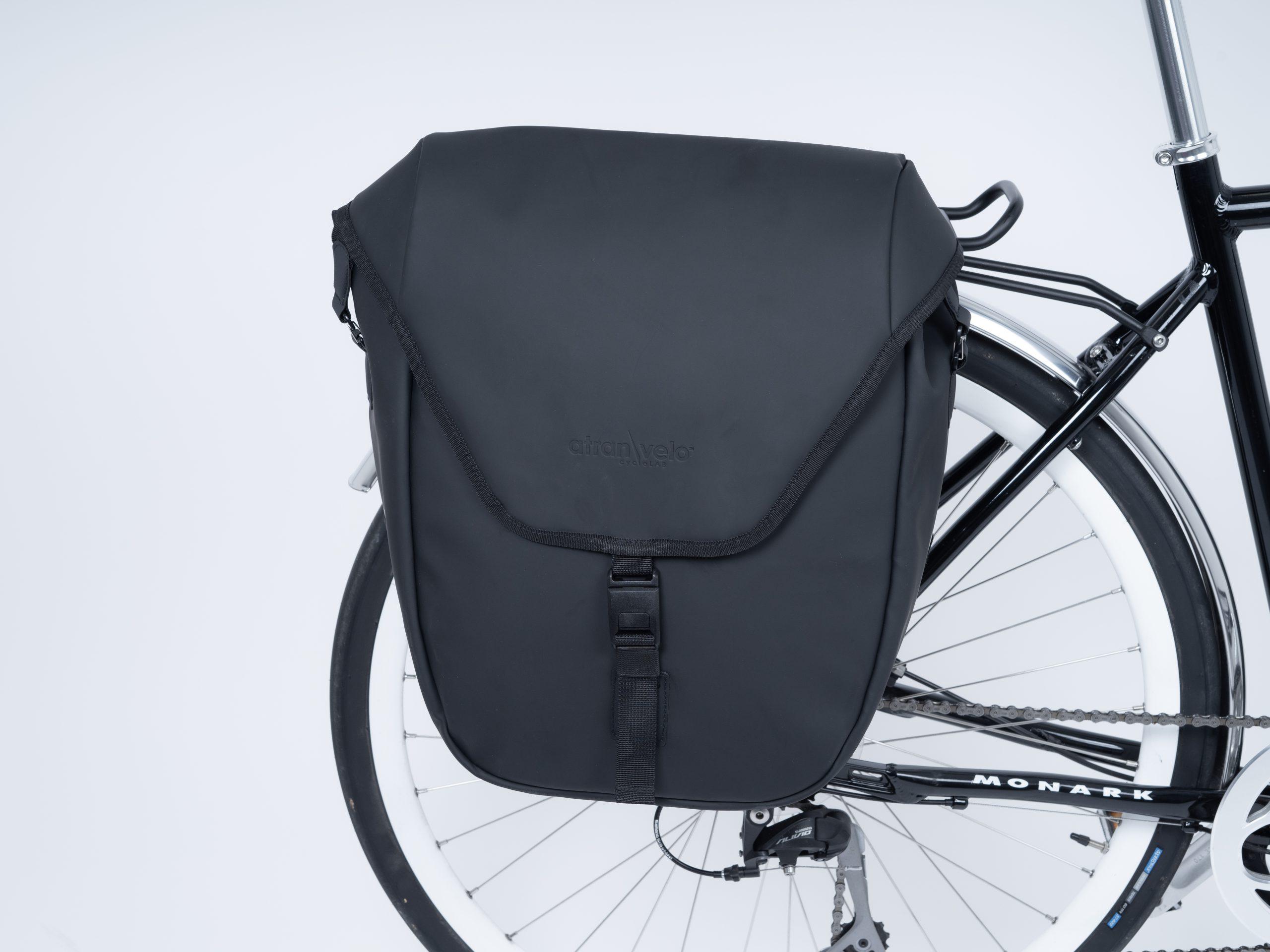 A black sidebag in a studio on a bike