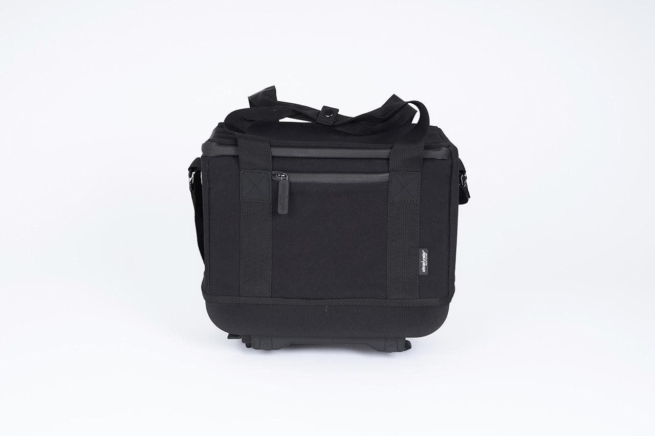 A black topbag in a studio