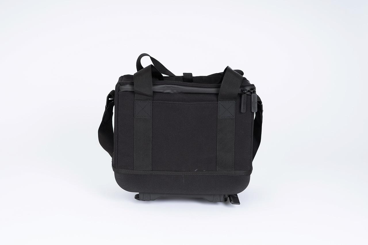 A black topbag in a studio