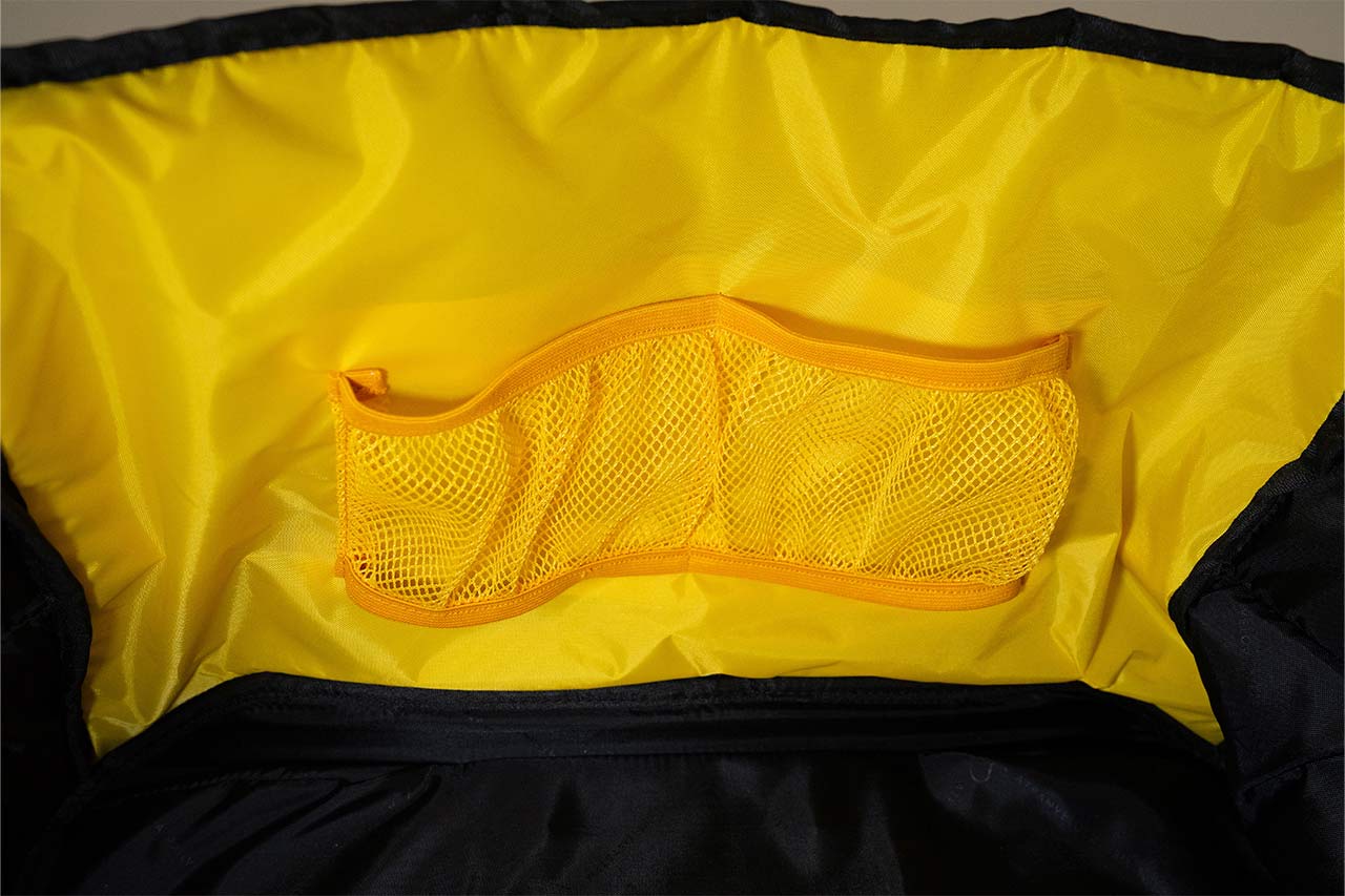A yellow inside of a bag with two pockets