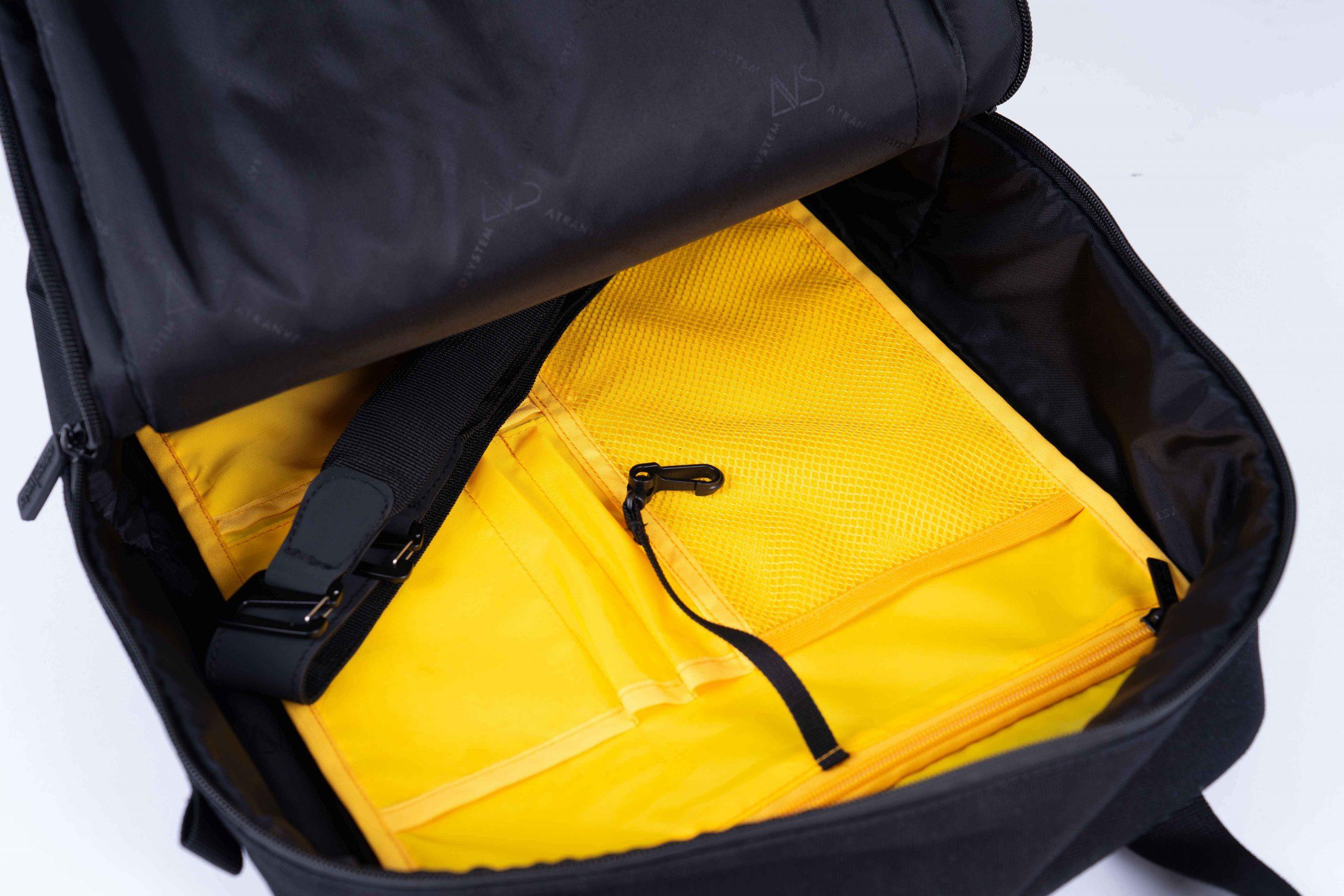 A yellow inside of a bag with pockets
