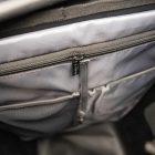 Inside of the commuter bag, a big zippered pocket and two other pockets