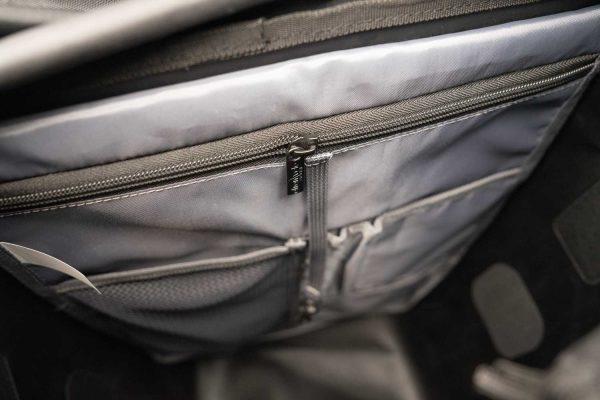 Inside of the commuter bag, a big zippered pocket and two other pockets