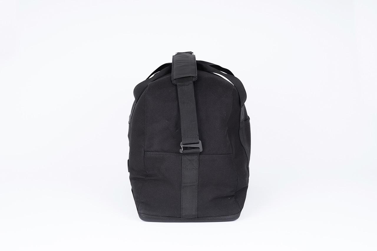 A black topbag in a studio