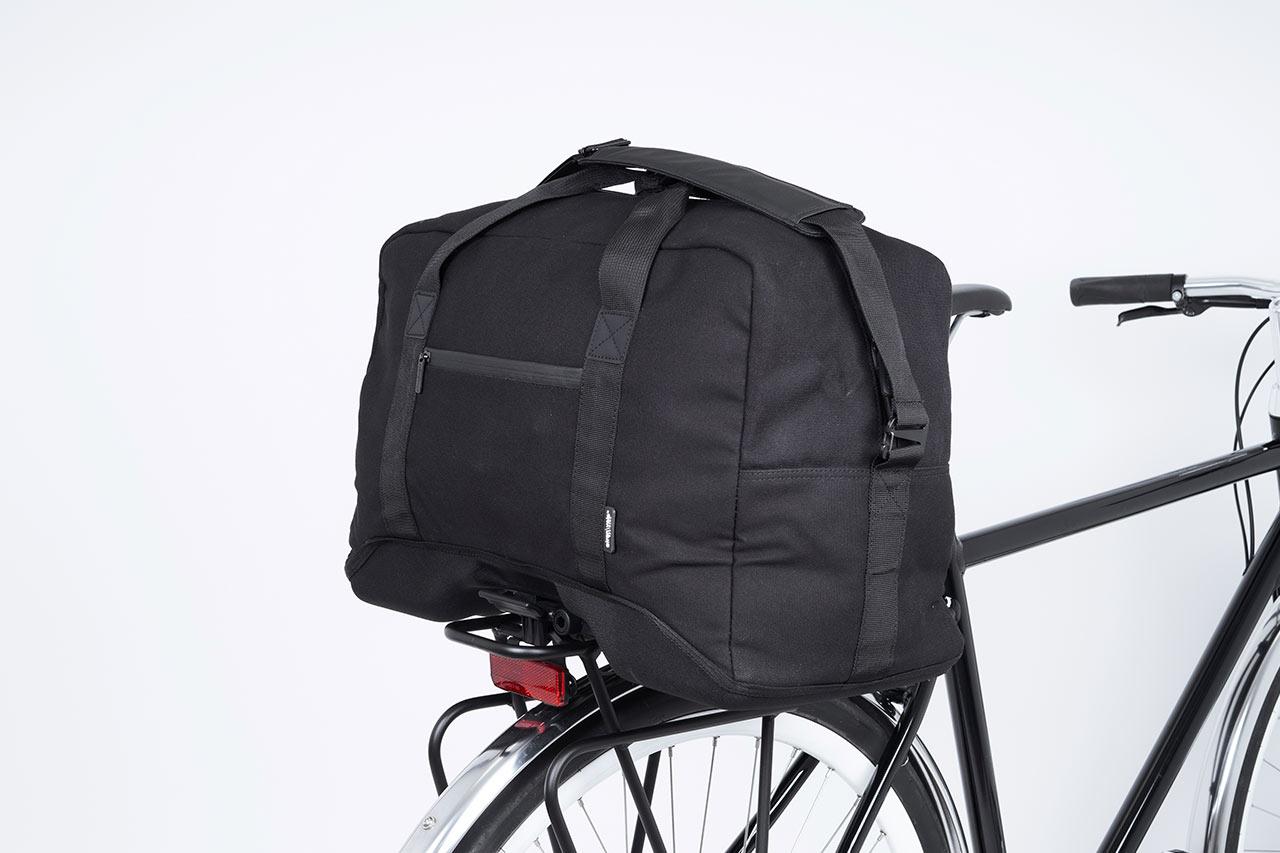 A black topbag in a studio at a bike