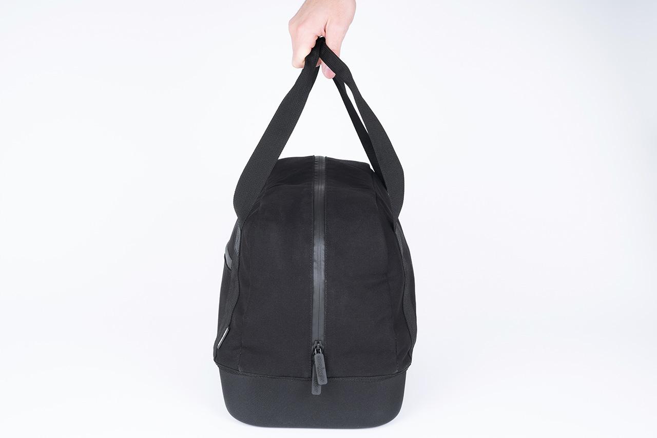 A black topbag in a studio