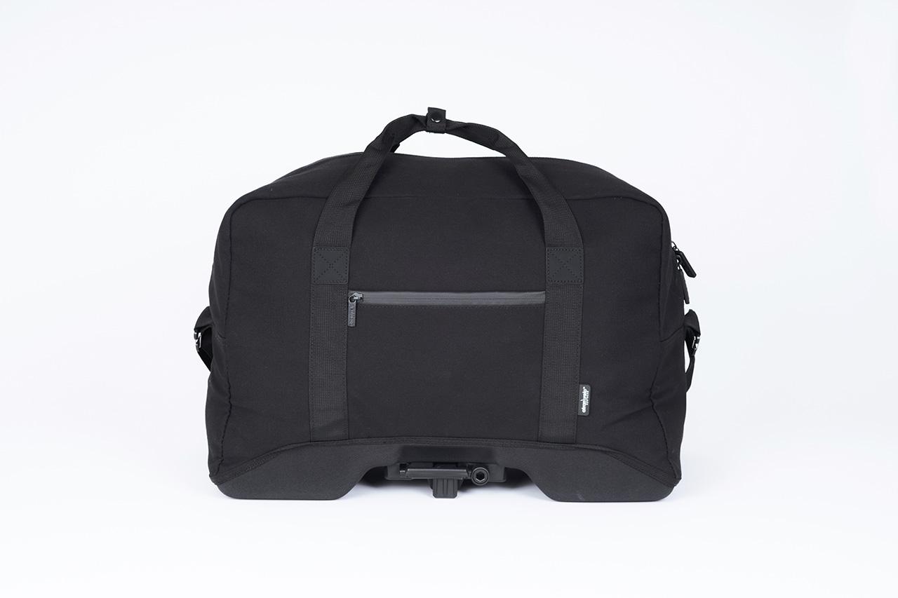 A black topbag in a studio