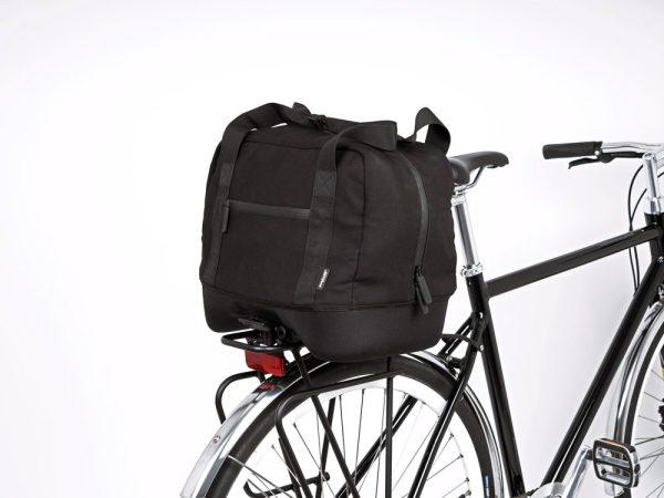 A black topbag in a studio on a bicycle