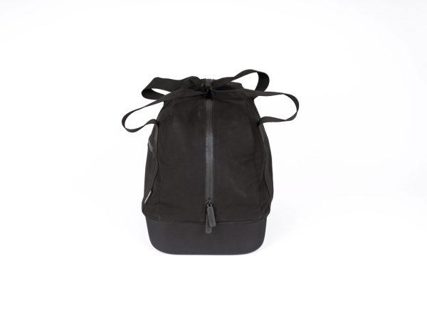 A black topbag in a studio