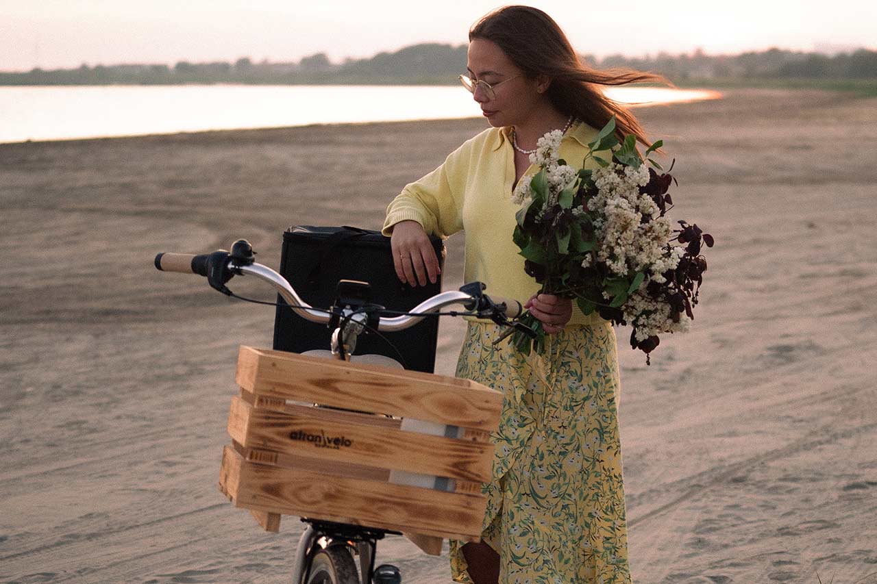 Woman at the beach with a wooden basket
