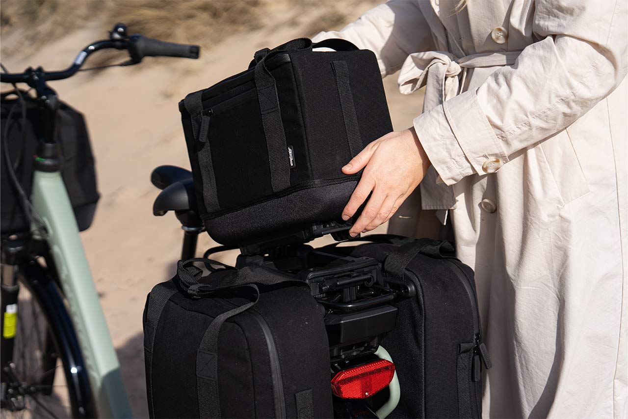 two sidebags and two topbags on a bike at the beach