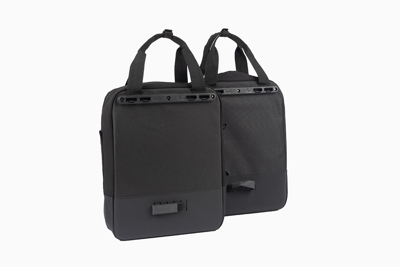 Two black sidebags in a studio