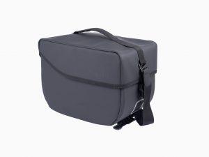 A studiopicture at a grey topbag from the side