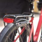 Closeup ona avs side unibar on a red bicycle on the rear carrier.