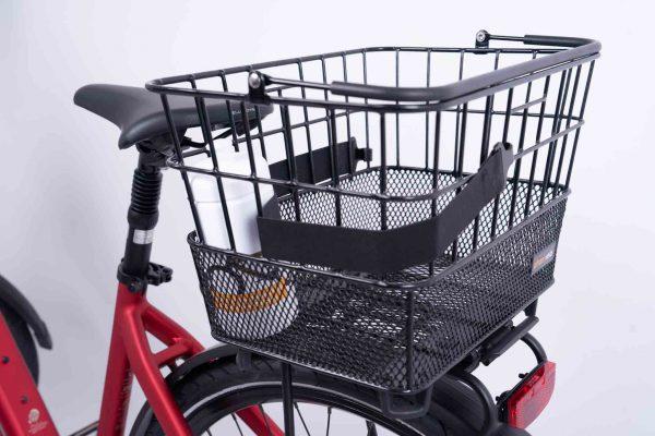 An elastic black buckle on a basket on a front carrier