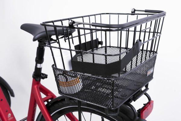 An elastic black buckle on a basket on a front carrier