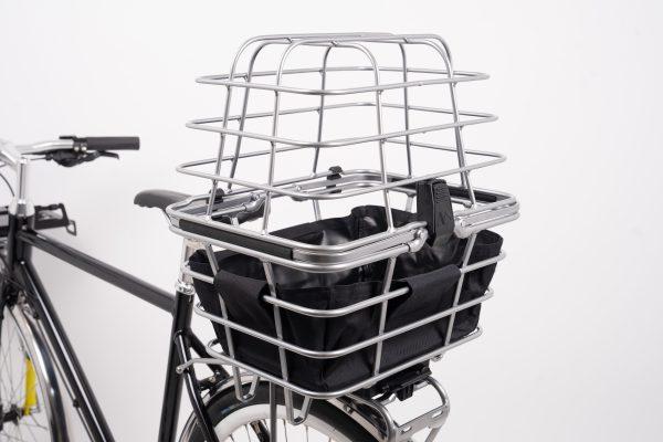 A basket and a cover with infill on a bike