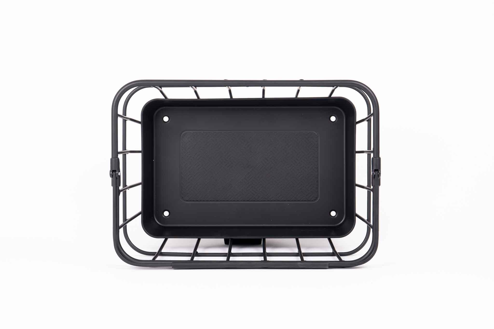 Black colored basket in studio