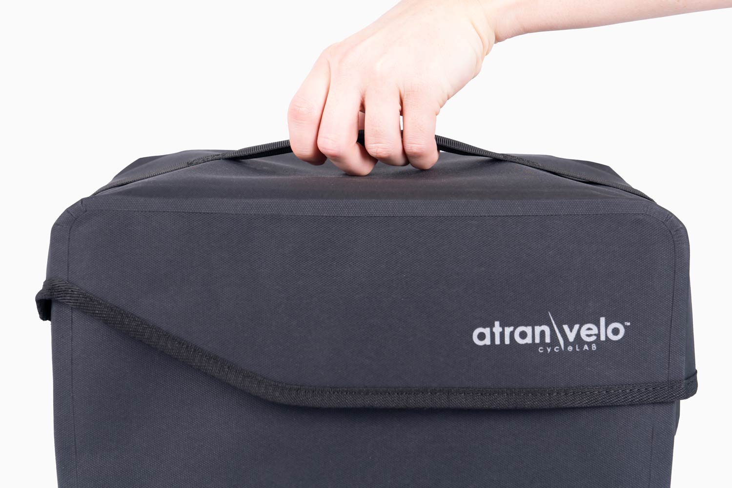 A close-up on a dark grey top bags carrying handle