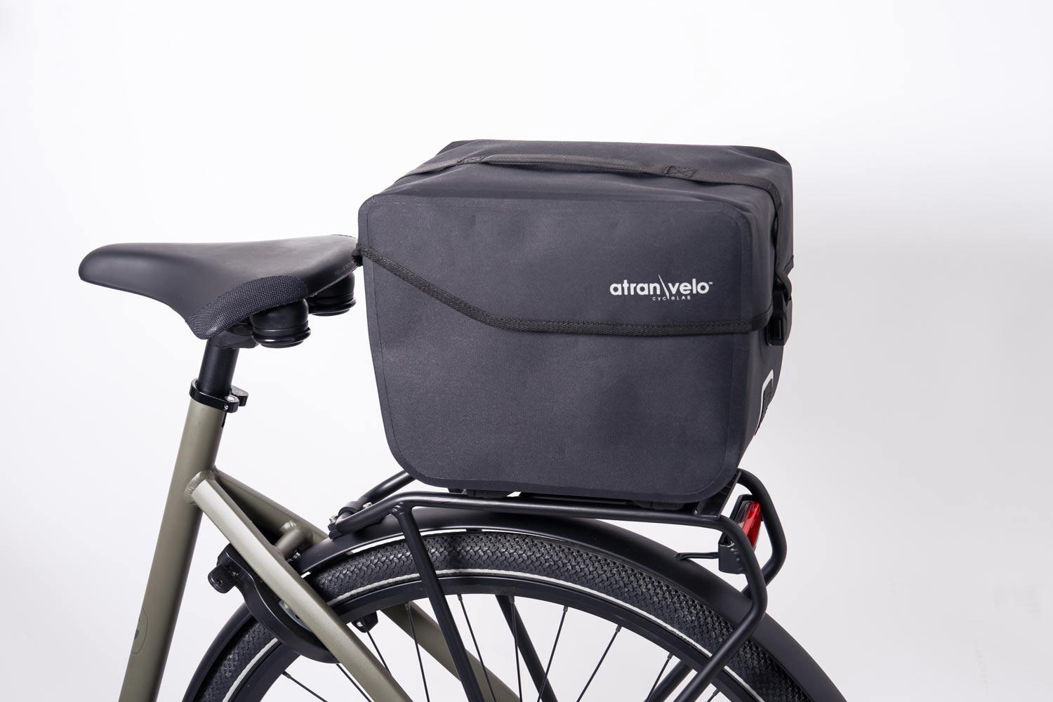 The black top bag commuter top wp in the back on a bicycle