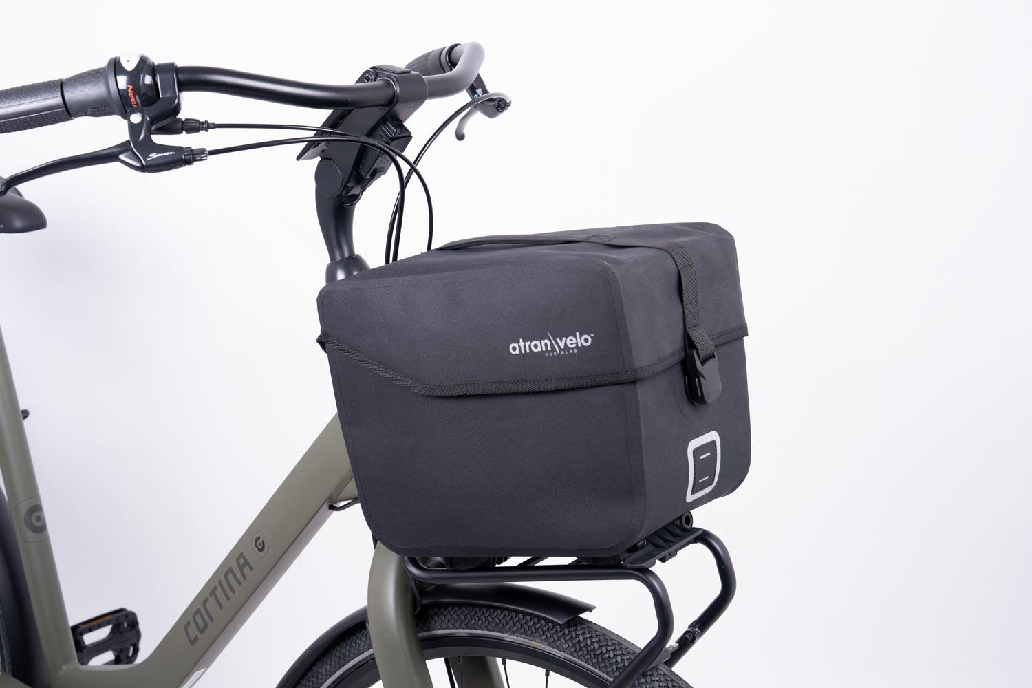 The black top bag commuter top wp in the front on a bicycle