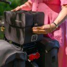 Woman opens a commuter top wp outside