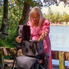 Woman in pink dress opens a commuter top wp outside