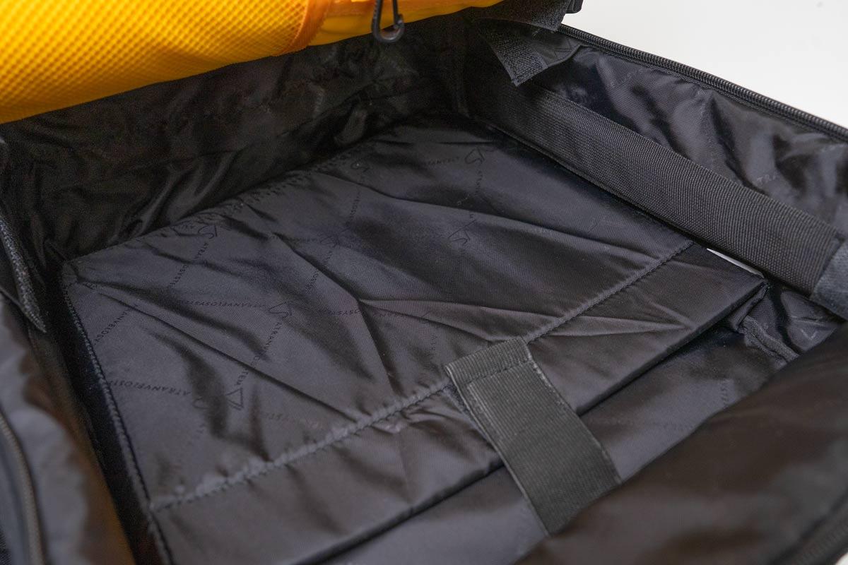 A picture of a black bags inside, a pc compartment